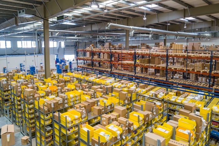 Warehouse packer preparing goods for dispatch