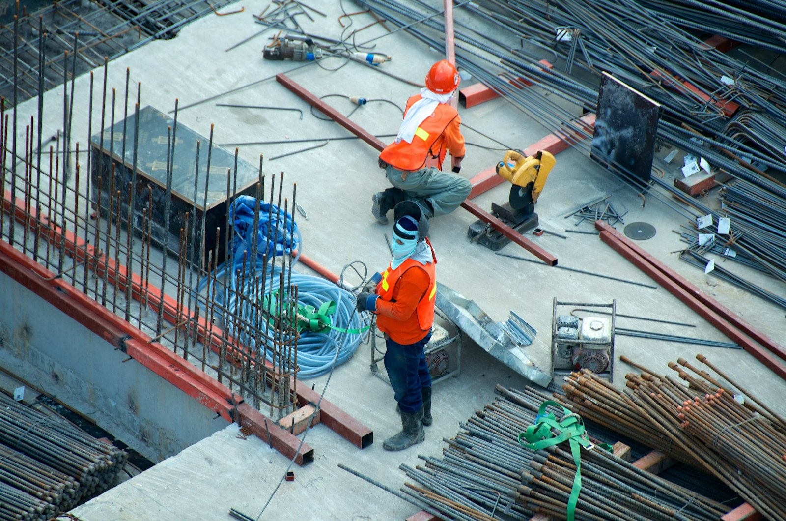Construction crew handling materials on site