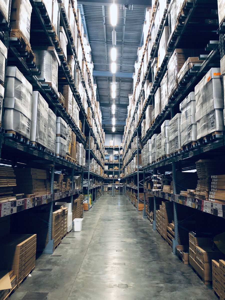 Warehouse worker among stocked shelves